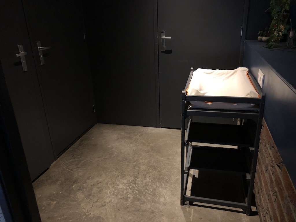 A photo of a diaper changing station at a lunch place in the Netherlands